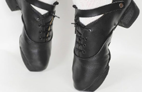 A pair of Ultra Light dance shoes with white socks.