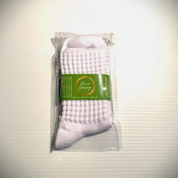 A Kathleen's Sassy Ultra Low Sock in a package on a white surface.
