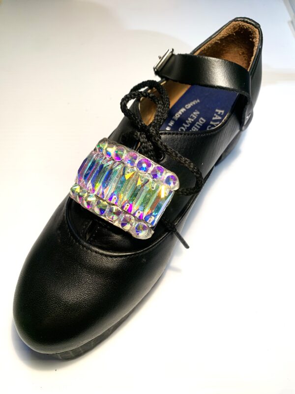 A pair of black shoes with a AB Crystal Diamante 8 Bar Buckle.