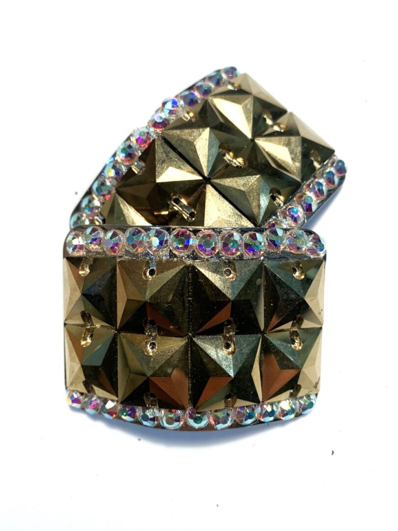A gold brooch with Mini 8 Square Diamante Buckle and rhinestones.